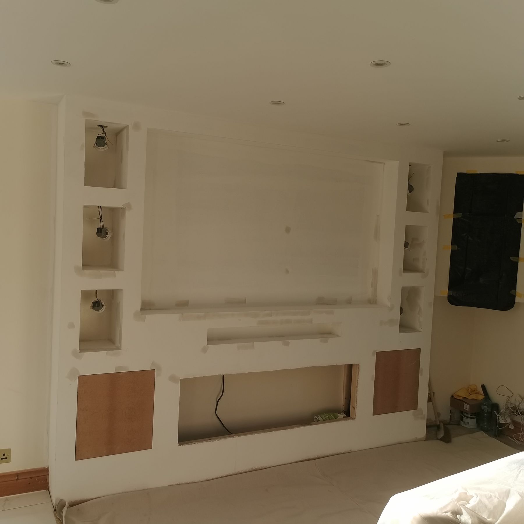 Plaster stage of the same media wall before painting and fitting