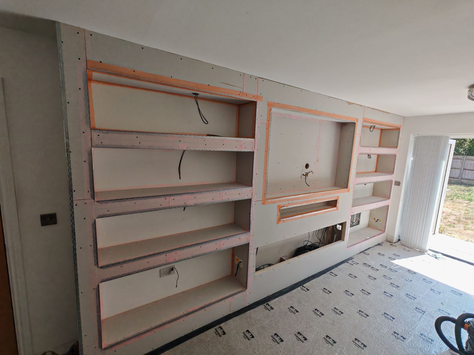 Bare timber stud frame for a media wall, before boarding